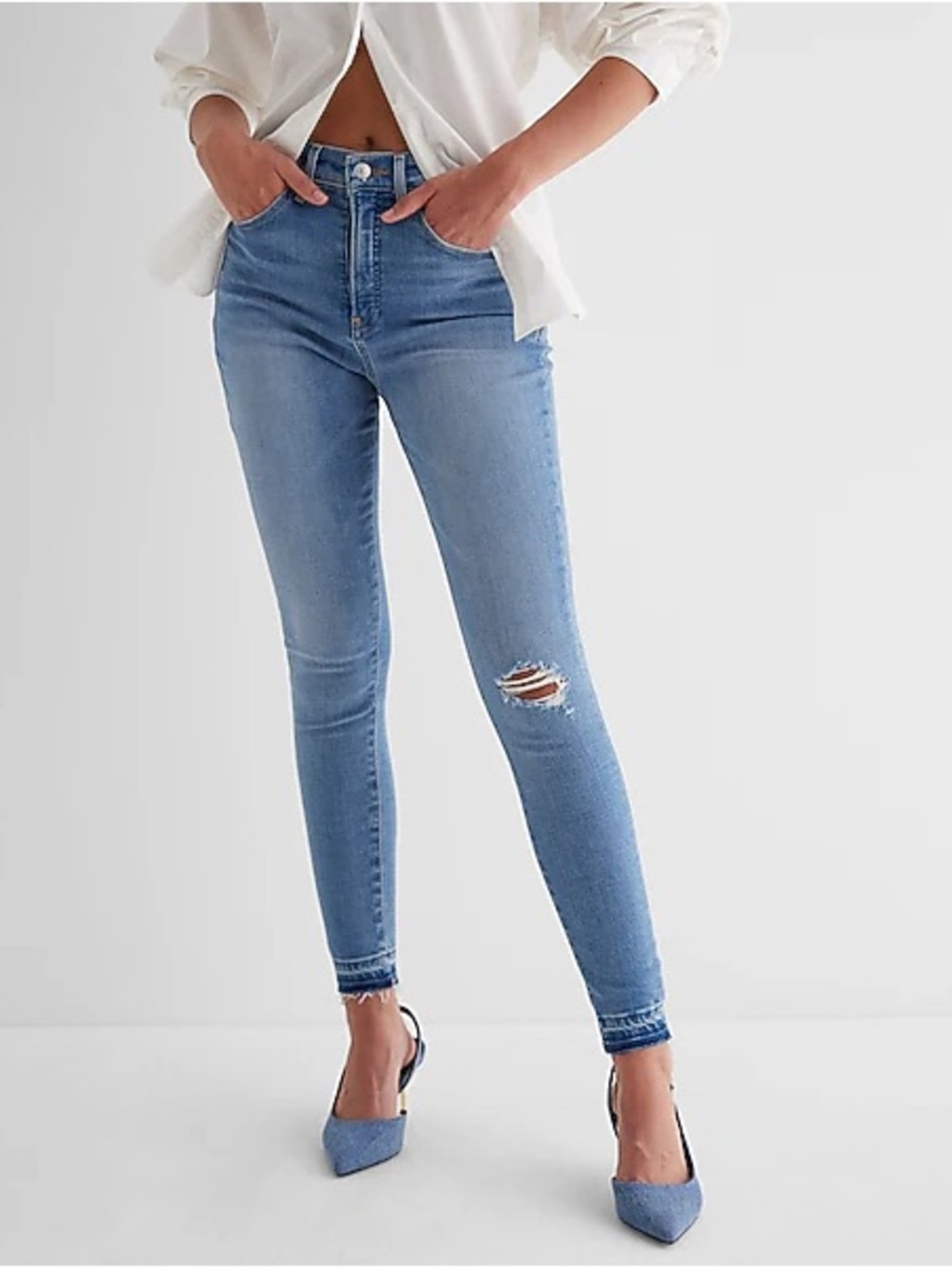 High Waisted Medium Wash Ripped Raw Drop Hem Skinny
Jeans
